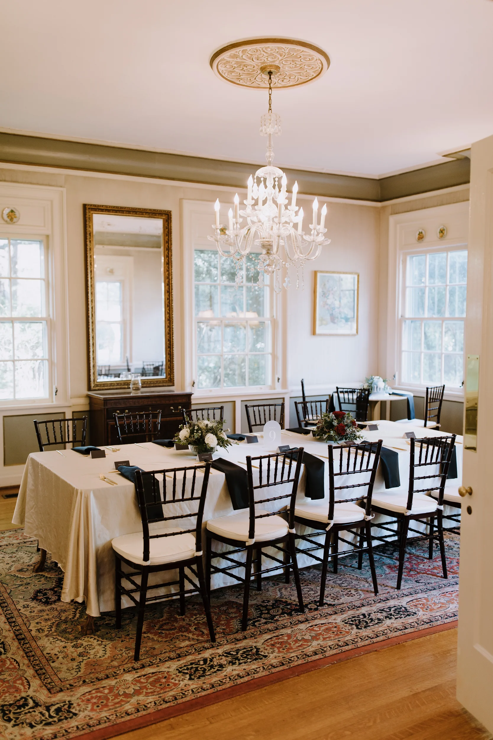 a formal dining room with a table set for a meal